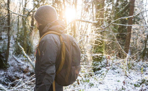 A person hiking with the Guide's Edition Synik 30.